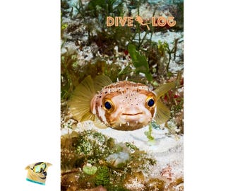 May include: A dive log notebook featuring a close-up of a pufferfish with a smiling expression. The fish has a brown and white body with blue eyes and is surrounded by underwater plants. The words "DIVE LOG" are printed at the top.