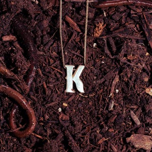 May include: A distressed wooden sign, inscribed with 'Welcome to our home' in white. The sign has a rustic appearance, ideal for a porch or hallway, and is designed with a simple, welcoming aesthetic.