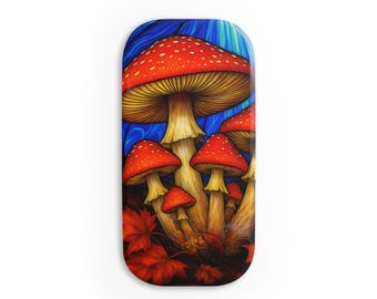 May include: A rectangular computer mouse featuring a vibrant illustration of several red mushrooms with white spots, set against a deep blue background with swirling patterns. Red maple leaves are visible at the base of the mushroom cluster.