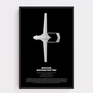 May include: A framed poster featuring a white Bayraktar TB2 unmanned aerial vehicle viewed from above against a black background. Text includes technical specifications, the name Bayraktar TB2, and a descriptive paragraph about the aircraft.