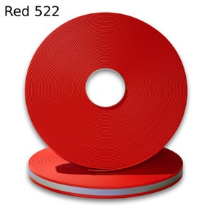 May include: A roll of red reflective webbing with a silver reflective stripe. The roll is labeled "Red 522".