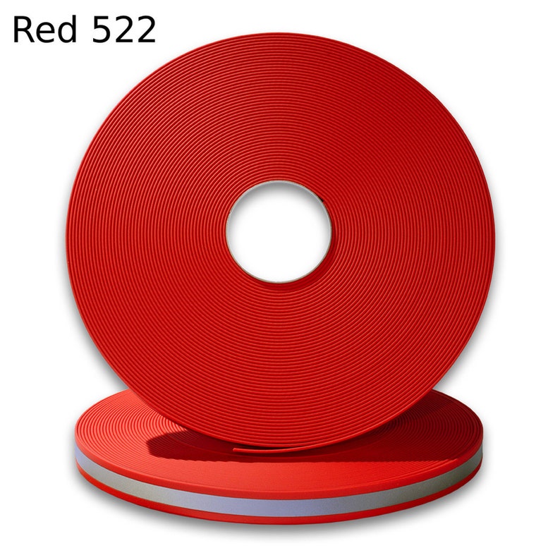 May include: A roll of red reflective webbing with a silver reflective stripe. The roll is labeled "Red 522".