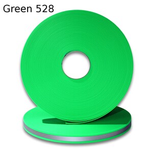 May include: A roll of green reflective webbing with a silver reflective strip. Green 528.