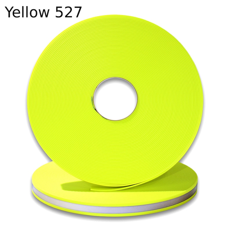 May include: A roll of bright yellow reflective tape with a white reflective stripe. The tape is labeled "Yellow 527".