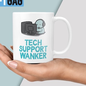May include: White ceramic mug featuring a blue cartoon illustration of a person wearing headphones and sitting at a computer. The text "TECH SUPPORT WANKER" is printed in blue below the illustration.