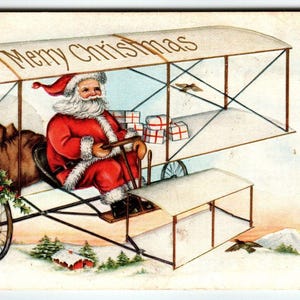Weihnachtsmann Weihnachtspostkarte St. Nick im Luftschiff Flugzeug Whithney geprägt