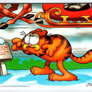 Vintage carte postale de Noël Garfield « Attention, traîneaux volant à basse altitude » rennes inutilisée