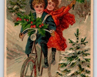 Christmas Postcard Children On Bicycle Boy Girl Embossed Germany Snow BW 296