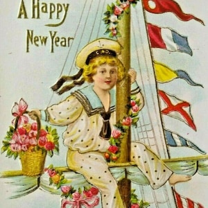 May include: Vintage nautical-themed New Year's postcard. A child in a sailor suit sits on a sailboat, holding a basket of flowers. The words "A Happy New Year" are at the top. The sailboat has colorful signal flags.