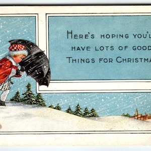 Weihnachtliche Weihnachtspostkarte mit Mädchen in der Hand eines Schneesturms