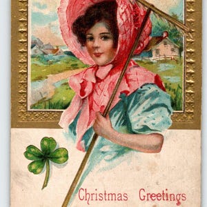 Weihnachts-Postkarte Grüße aus Rom Ohio Farmer-Mädchen mit Rechen Shamrock AMP