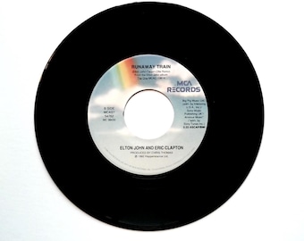 Elton John y Kiki Dee – Amor verdadero / Elton John y Eric Clapton – Tren desbocado 45