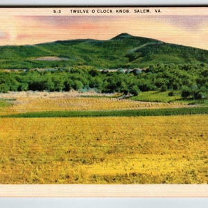 May include: Vintage postcard featuring a landscape view of Twelve O'Clock Knob in Salem, VA. The image shows a green mountain, a field of yellow and green crops, and a line of trees. The sky has a pink and orange hue.