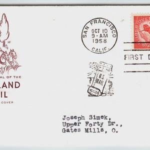 May include: A white envelope marking the Centennial of Overland Mail. It has a maroon stagecoach and horses illustration, a San Francisco postmark dated October 10, 1958, and a red postage stamp with a stagecoach design. The text "FIRST DAY OF ISSUE" is printed below.
