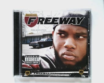 May include: CD case for the album "Freeway" by Freeway. The cover features a portrait of the artist, the album title, and a Philadelphia road sign graphic. A parental advisory warning is also visible.