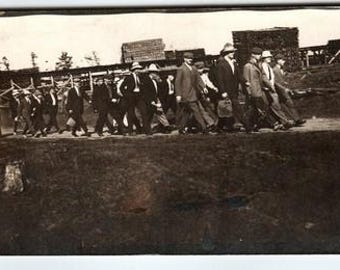 Vintage Real Photo Postcard Men Marching Industrial Scene 1910 Antique