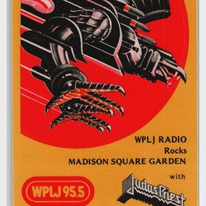 May include: A rectangular sticker with a yellow background featuring a black and red robotic claw graphic. Text reads: WPLJ RADIO Rocks MADISON SQUARE GARDEN with Judas Priest, WPLJ 95.5 NEW YORK'S BEST ROCK, and ROCKTOBER 2, 1982. The design has rounded corners.