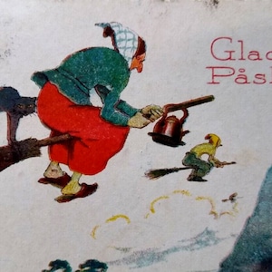 May include: A vintage Easter card featuring a witch flying on a broomstick with a black cat and a kettle. The text "Glad Påsk" is written in red on the card.