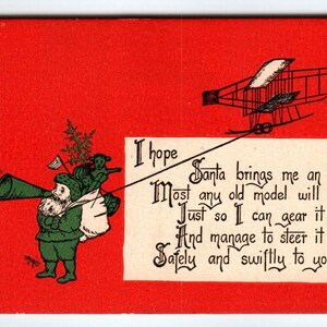 Carte postale de Noël Prince GK Costume vert Père Noël Avion MMS Rare