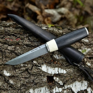 The puukko knife, 80crv2 steel, stabilised bog oak/antler, leather sheath, hand made.
