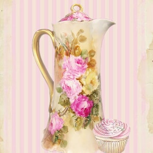 May include: A vintage porcelain teapot with a floral design and gold accents. The teapot has a lid and a handle. A pink cupcake is next to the teapot.