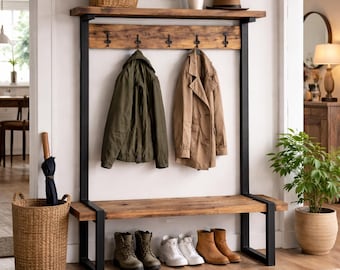 May include: A rustic entryway bench with a wooden shelf and coat rack. The bench has a dark metal frame and a wooden seat. Two coats hang from the hooks, and several pairs of boots are lined up below. A woven basket and umbrella are on the left.