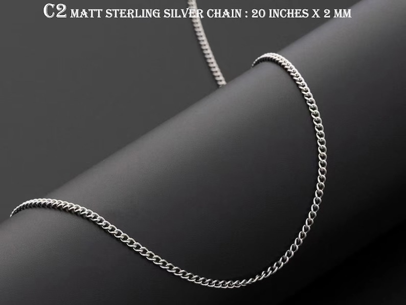 May include: A silver chain necklace with a matte finish. The chain is 20 inches long and 2 millimetres wide. C2 MATT STERLING SILVER CHAIN : 20 INCHES X 2 MM