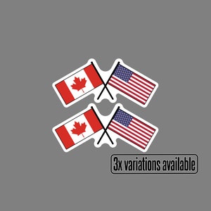Peut inclure: Deux paires de drapeaux croisés, un drapeau canadien et un drapeau américain. Les drapeaux sont rouge, blanc et bleu. Le texte "3x variations disponibles" est sous les drapeaux.