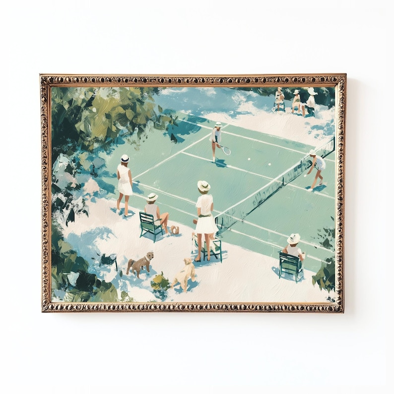 May include: A framed art print depicts a tennis match scene. The artwork features a light blue tennis court, players in white attire, and spectators with dogs. The frame has a gold ornate design, adding a vintage aesthetic.