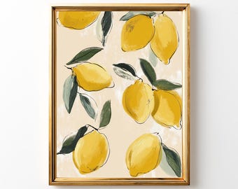 May include: A framed art print featuring a lemon illustration. The artwork showcases bright yellow lemons with green leaves against a cream-colored background. The frame is gold. The style is reminiscent of a watercolor painting.