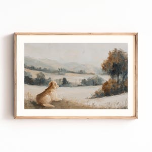 May include: A framed landscape painting featuring a golden retriever dog resting in a field, gazing at a distant mountain range. The artwork uses muted tones of beige, brown, and blue, creating a serene and pastoral scene.