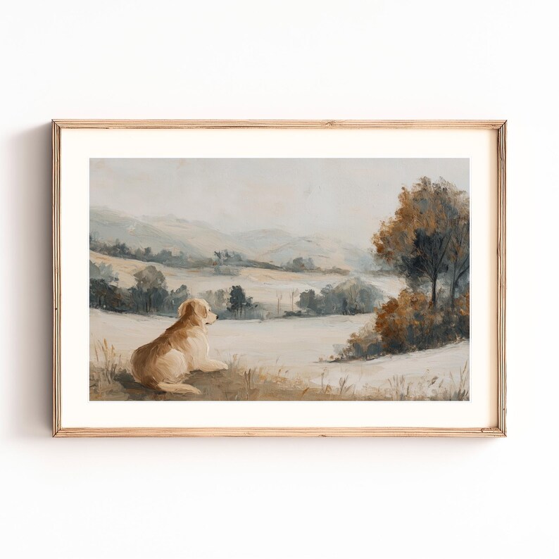 May include: A framed landscape painting featuring a golden retriever dog resting in a field, gazing at a distant mountain range. The artwork uses muted tones of beige, brown, and blue, creating a serene and pastoral scene.