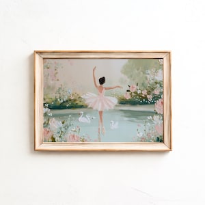 May include: A framed painting of a ballerina in a pink tutu on a lake with swans. The artwork uses a soft palette of pinks, greens, and blues, with floral accents and a light-coloured wooden frame.