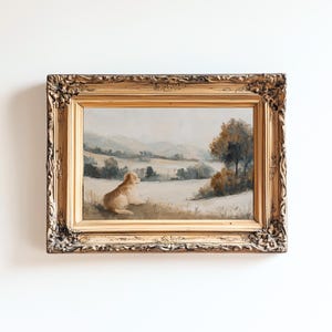 May include: An antique framed landscape painting featuring a dog resting in a field. The artwork has a gold ornate frame. The painting depicts a serene outdoor scene with rolling hills, trees, and a dog in the foreground. The color palette includes muted tones of beige, brown, and blue.