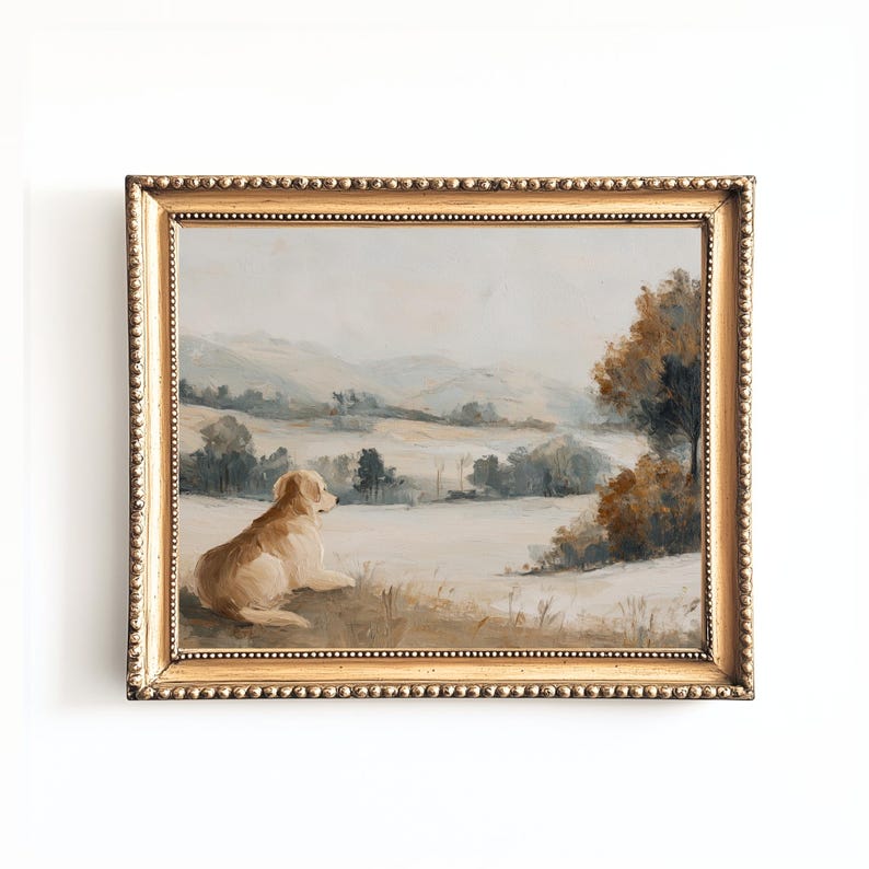 May include: A framed landscape painting featuring a golden retriever dog resting in a field. The artwork has a gold ornate frame and depicts a serene outdoor scene with rolling hills and trees in muted tones of beige, brown, and blue.
