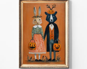 May include: A framed Halloween-themed painting featuring a rabbit and a bear dressed in festive attire. The rabbit wears a floral crown and a dress, while the bear dons a coat and vest. Both hold jack-o'-lanterns against an orange background.