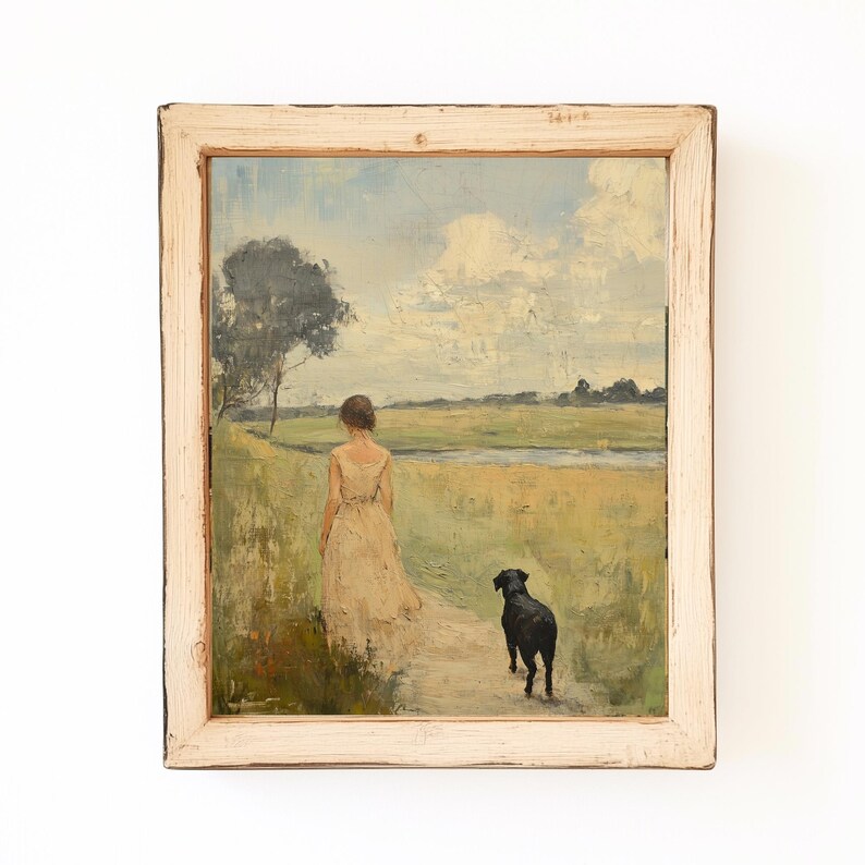 May include: A framed oil painting depicting a woman in a white dress walking with a black dog on a path through a field. The sky is blue with white clouds.