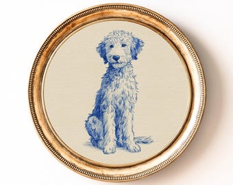 May include: A pen and ink drawing of a Goldendoodle dog in blue and white, presented in a round, gold-coloured frame. The dog is depicted sitting, with fluffy fur, against a cream background. The frame has a detailed, textured edge.