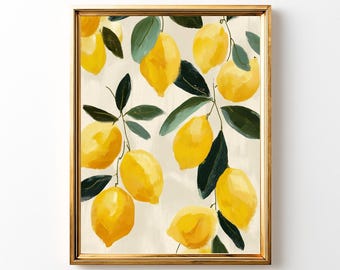 May include: A framed art print featuring a watercolor painting of lemons and green leaves on a light beige background. The lemons are yellow and the leaves are dark green. The frame is gold.