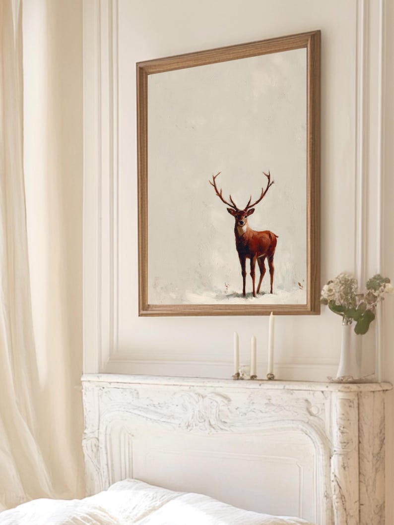 May include: A framed art print featuring a majestic deer with large antlers. The deer is depicted in shades of brown and red against a neutral background. The artwork is encased in a wooden frame, adding a touch of rustic elegance to the wall decor.