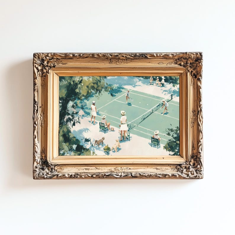 May include: A framed vintage print depicts a tennis match on a green court. Players in white attire are positioned around the net, with spectators in chairs. The ornate gold frame adds a classic touch to the artwork, set against a white background.