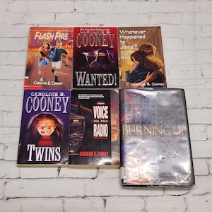 May include: A collection of six young adult novels by Caroline B. Cooney, including Flash Fire, Wanted, Whatever Happened to Janie, Twins, The Voice on the Radio, and Burning Up. The books feature illustrated covers with various character designs.