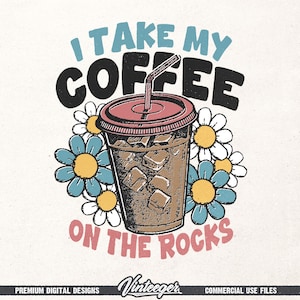 May include: A retro-style graphic featuring an iced coffee in a clear cup with a red lid and straw, surrounded by blue and white daisies. The text reads "I TAKE MY COFFEE ON THE ROCKS" in a vintage font.