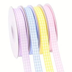 May include: Spools of gingham ribbon in pastel colors: lavender, light blue, yellow, and pink. The ribbon is unwound, revealing the checkered pattern. Perfect for crafts, gift wrapping, and decorative projects.