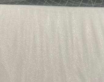 May include: A roll of white tulle fabric, tightly wound and ready for use. The fabric has a fine, open weave, creating a delicate and airy appearance. The tulle is a bright, clean white, suitable for various craft and design projects.