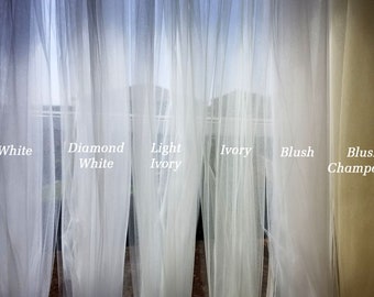 May include: Five sheer curtains in different shades of white and ivory. The curtains are labeled from left to right: White, Diamond White, Light Ivory, Ivory, Blush, and Blush Champagne.