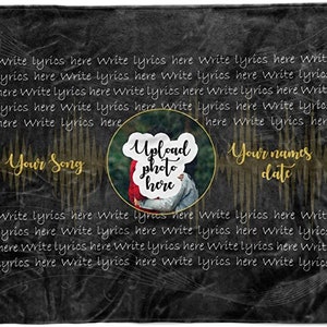 May include: Black and gold personalized blanket with a space to upload a photo and write lyrics for a song. The text reads "Your Song", "Upload photo here", "Your names date", and "Write lyrics here".
