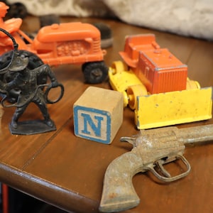 Vintage group of toys: Gun,bull dozer,tractor, cowboy,wood block