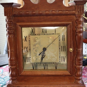 Vintage hangs on the wall, grandfather clock head runs on batteries. Working!
