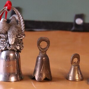 Vintage group of miniature bells and candle stick